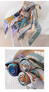 Close-up of rolled silk scarves showing intricate vintage patterns and fine texture.