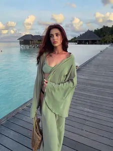Elegant sage green three-piece loungewear set with cardigan and wide-leg pants