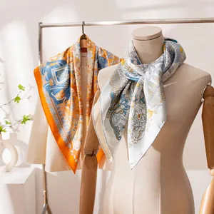 Elegant double-sided printed mulberry silk scarf with hand-rolled edges shown on mannequin