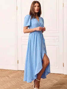 Elegant light blue short-sleeve wrap maxi dress with high side slit detail on model