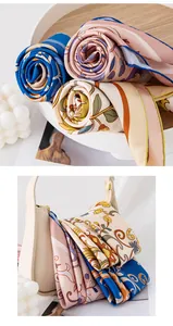 Close-up of premium floral mulberry silk scarves with elegant hand-rolled edges.