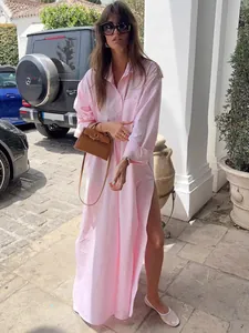 Elegant pink French style maxi shirt dress with a high side slit for beach vacation.