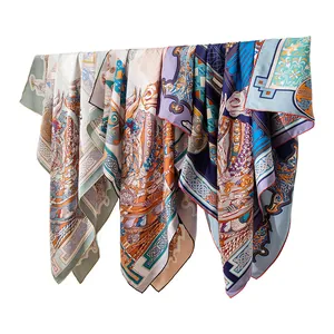 Premium mulberry silk scarf with vibrant double-sided print patterns and hand-rolled edges