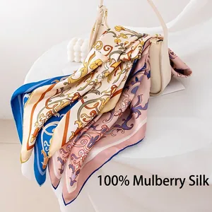 Luxury 100% mulberry silk square scarf with elegant floral print draped on a handbag