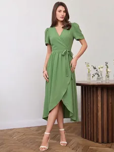 Elegant green short sleeve wrap dress with asymmetrical hemline and waist tie detail