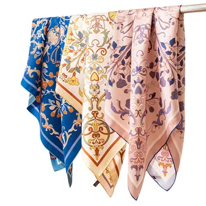 Luxury mulberry silk square scarves with elegant floral prints and hand-rolled edges.