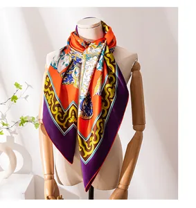Detailed shot of vibrant printed patterns on a luxury mulberry silk square scarf on mannequin