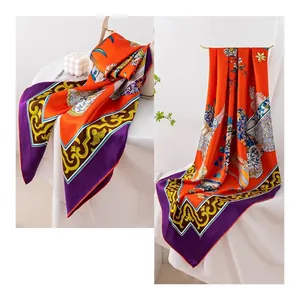Elegant orange mulberry silk square scarf with luxury floral print and purple border.