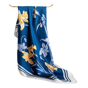 Elegant blue mulberry silk scarf with yellow floral iris pattern and white border