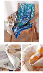 Detailed macro shot of premium silk scarf showing smooth texture and hand-rolled edge