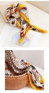 Detail of luxury orange leopard print silk square scarf draped on a woven basket
