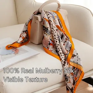 Elegant 53cm orange leopard print 100% mulberry silk square scarf draped on a handbag