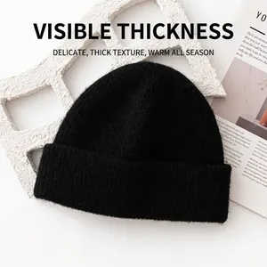 Warm 93% wool knitted beanie hat for winter outdoor activities in solid black style