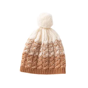 Premium 100% sheep wool knit beanie hat with a fluffy pom-pom in warm camel color