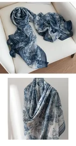 Detail view of blue Toile de Jouy silk scarf with elegant landscape pattern print