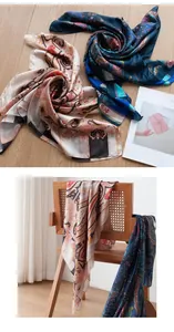 Detail view of bohemian silk scarves with paisley pattern draped on a wooden chair.