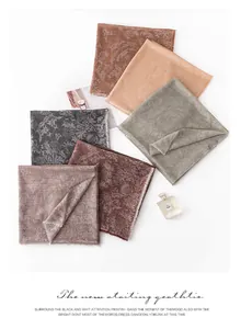 Detailed view of French retro paisley jacquard cashmere scarves in multiple colors.