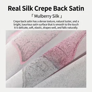 Macro detailed view of premium mulberry silk satin scarf featuring magnolia ink print