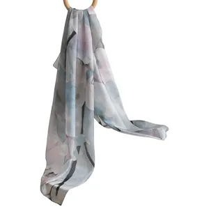 Elegant silk scarf for women featuring a delicate ink-wash magnolia floral print design