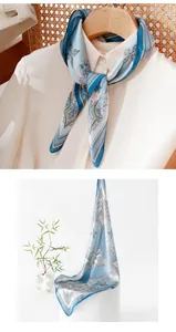 Detailed view of a blue mulberry silk square scarf featuring an elegant paisley floral pattern