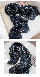 Close-up detail of high-quality navy mulberry silk scarf with elegant small floral print