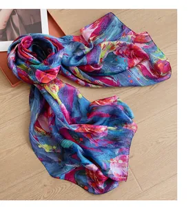 Detailed view of lightweight silk scarf with abstract floral rose print in vibrant colors.