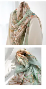 Detailed view of a mulberry silk scarf featuring elegant floral and bird patterns.
