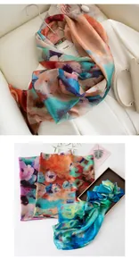 Detailed view of vintage oil painting style mulberry silk scarves with artistic patterns