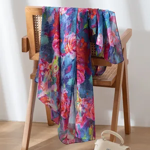 Elegant floral silk scarf with blue rose print for sun protection and beach shawl