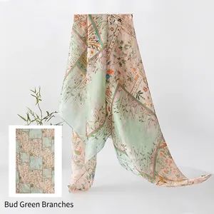 Elegant mulberry silk scarf featuring a pale green and pink floral bird pattern.