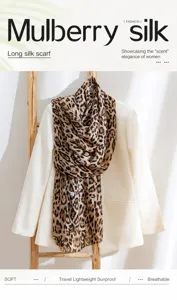 Leopard print mulberry silk long scarf draped over a stylish white blazer
