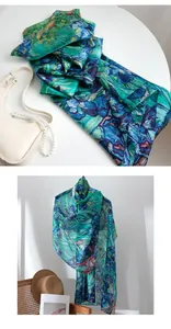 Detailed view of lightweight silk scarf with elegant blue and green iris floral print