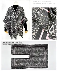Leopard print faux cashmere split poncho with pink border detail, size 152x114cm