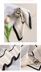 Detail view of a premium mulberry silk square scarf with elegant black stripes.