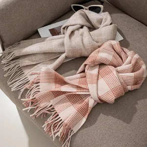 Pair of cozy 100% wool scarves featuring elegant cream and pink plaid patterns with fringes