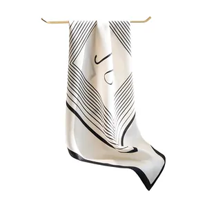 Elegant mulberry silk square scarf with black geometric print on white background