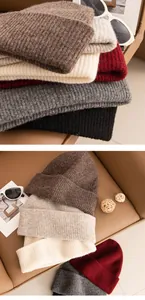 Detailed view of thick ribbed yak wool knitted beanies in various warm autumn colors