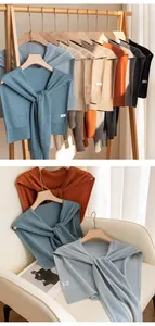 Detailed display of premium cashmere knit shawls in various colors and knotted styles