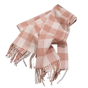 Cozy pink and cream plaid wool scarf with fringes for winter warmth and style