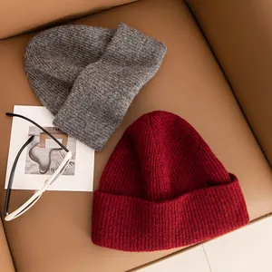 Premium 100% yak cashmere knitted beanies in grey and red for women winter fashion.