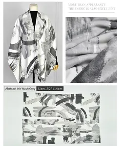 Detailed view of abstract ink gray faux cashmere shawl showing texture and flat-lay dimensions