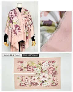 Detail of floral print imitation cashmere poncho shawl in lotus pink