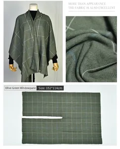 Detailed view of olive green plaid poncho featuring fabric texture and U-cut design
