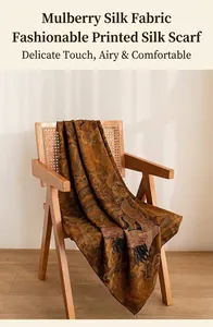 Elegant mulberry silk scarf with traditional crane print draped over a classic wooden chair