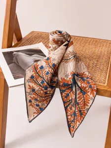 Detailed view of mulberry silk and wool blend scarf with elegant botanical pattern