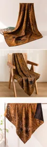 Detailed view of luxury mulberry silk scarf with traditional crane and wave patterns