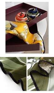 Detailansichten von Seidenschals mit eleganten Blumenprints und feinen Nähten