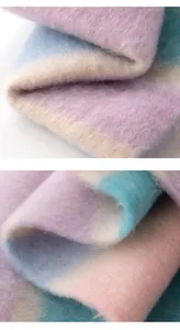Close-up of rainbow mohair scarf showing thick brushed texture and soft pastel colors.