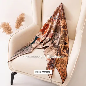 Elegant premium silk wool blend triangle scarf with intricate nature patterns on a chair