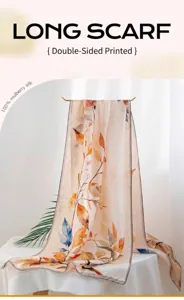Detailed view of mulberry silk long scarf with autumn leaf print on display rack